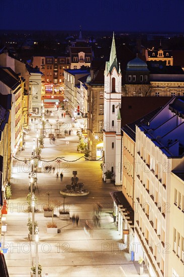 Illuminated old town street with tower of Schlosskirche