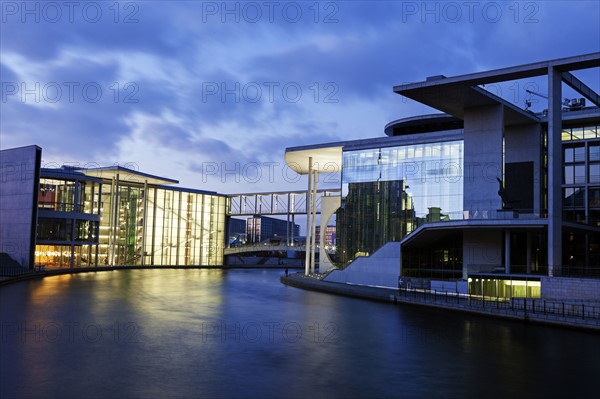 Federal Parliament offices illuminated at dusk