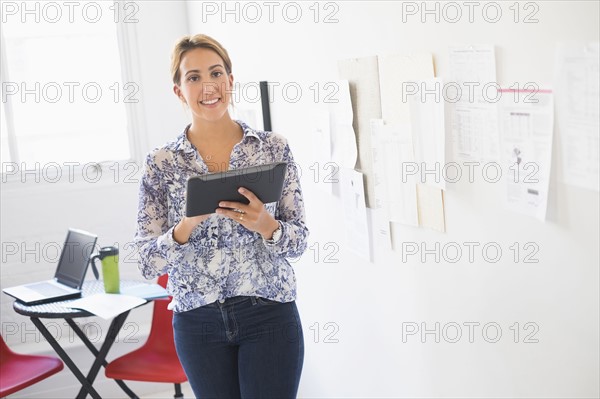 Young woman working in office.