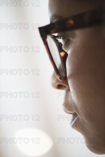 Close up of young woman in nerdy glasses.