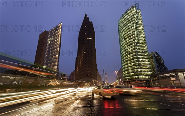 Illuminated skyscrapers and street traffic
