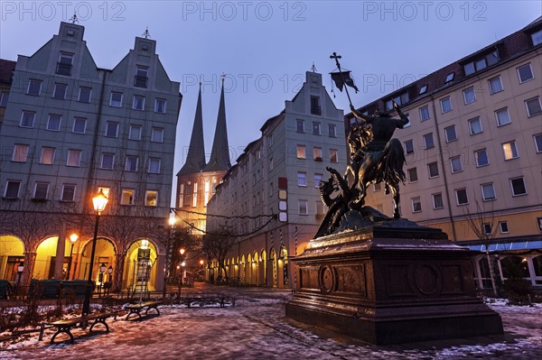 Equestrian statue on illuminated town square