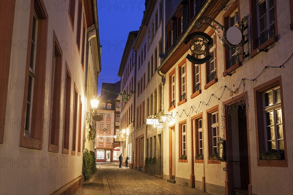View along illuminated old town street