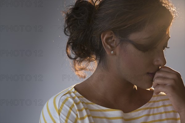 Portrait of young woman in studio.