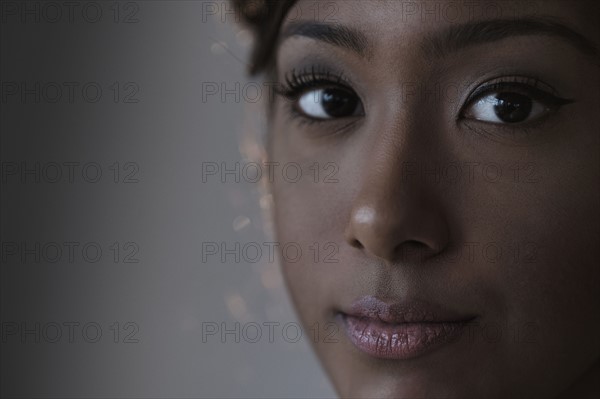 Portrait of young woman in studio.