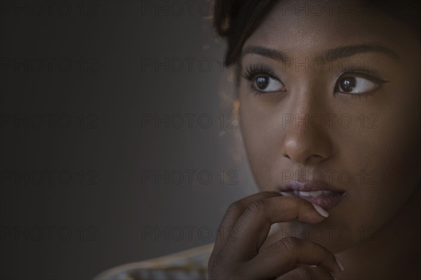 Portrait of young woman in studio.