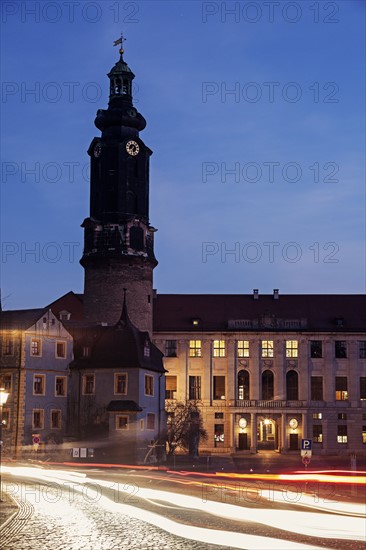 Light trails and clock tower at night