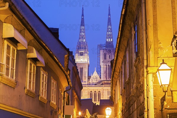 Illuminated street and spires of Zagreb Cathedral