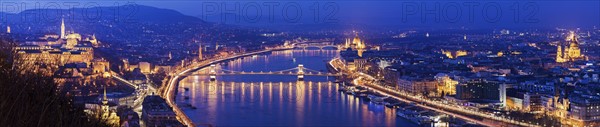 Illuminated cityscape with Danube River