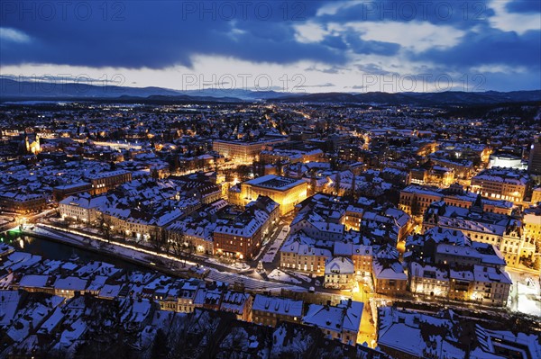 Illuminated cityscape at dusk