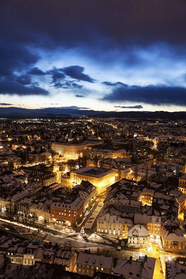 Illuminated cityscape at dusk