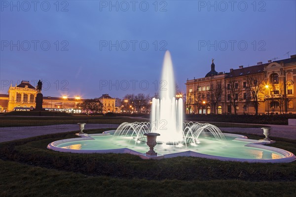 Illuminated fountain at night