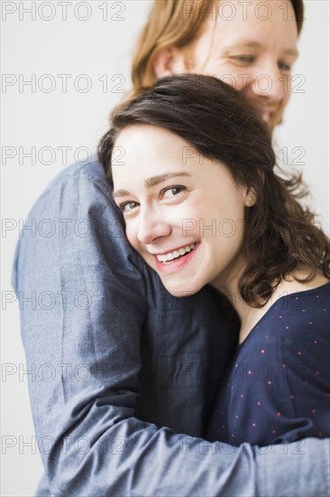 Smiling couple embracing