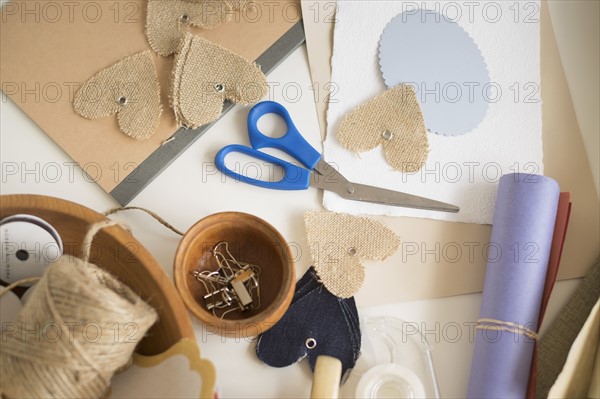 Crafts equipment on table.