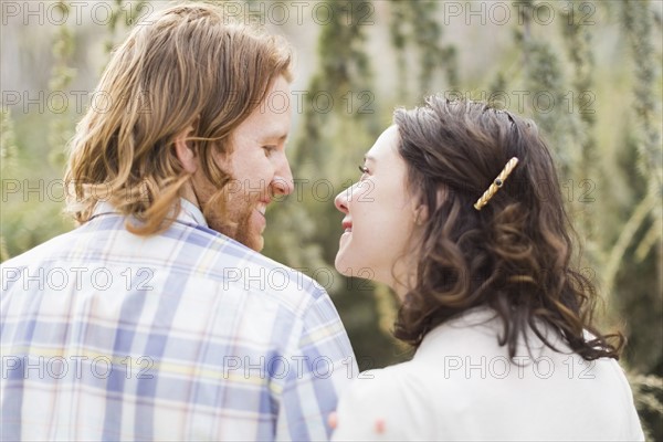 Smiling couple looking at each other