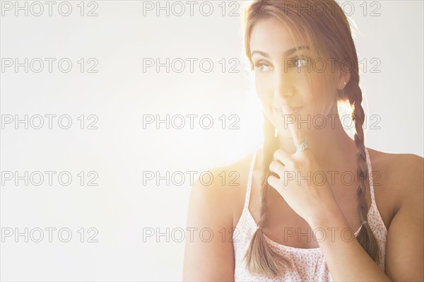 Portrait of young woman in studio.