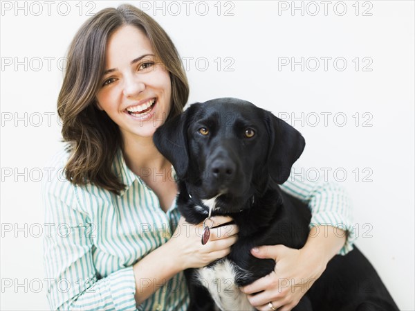 Portrait of smiling woman with dog