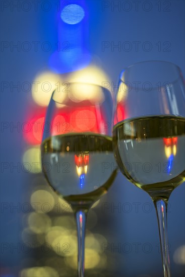 View of two wineglasses with white wine. USA, New York, New York City.