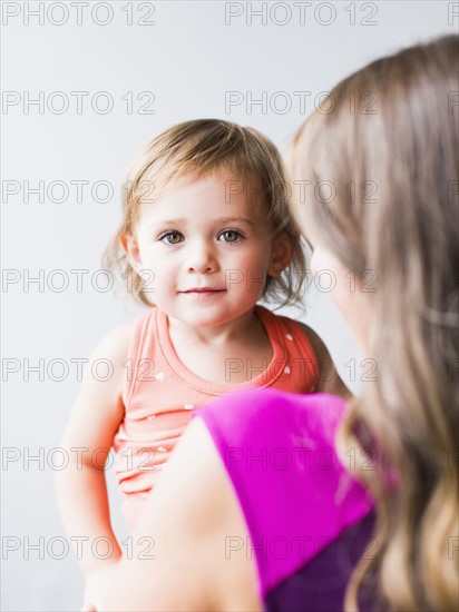 Little girl (2-3) with mother