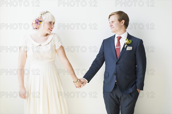 Smiling newlywed couple in studio