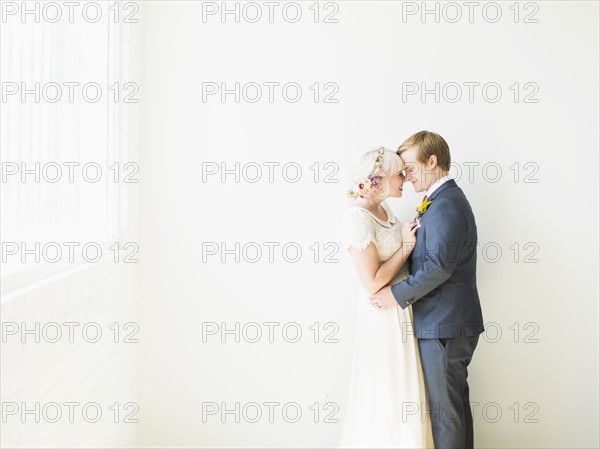 Newlywed couple embracing