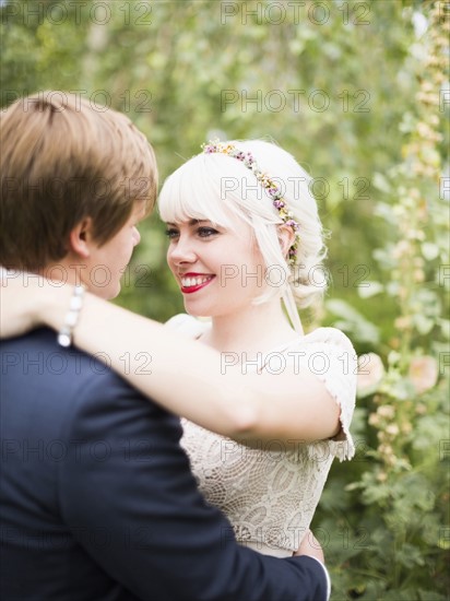 Newlywed couple embracing