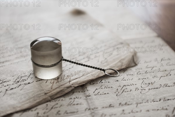 Old magnifying glass and letters.