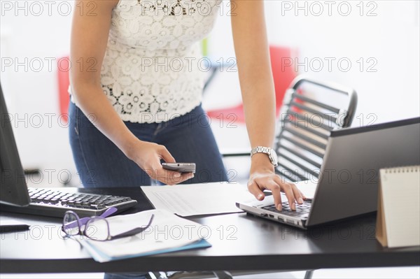 Young woman working in office.