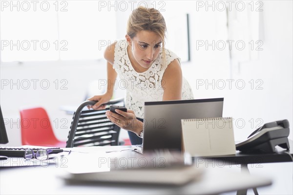 Young woman working in office.