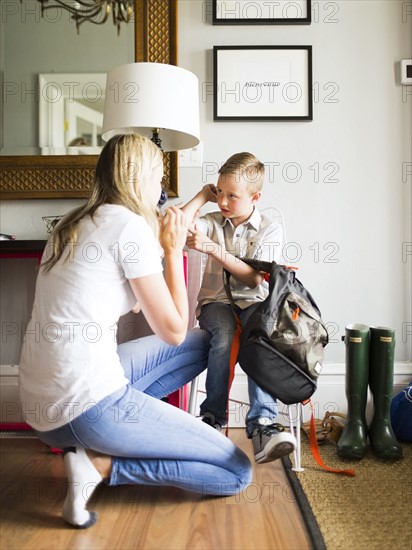 Mother talking with son (6-7)