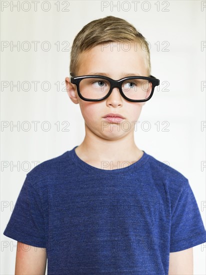Portrait of boy (6-7) wearing eyeglasses
