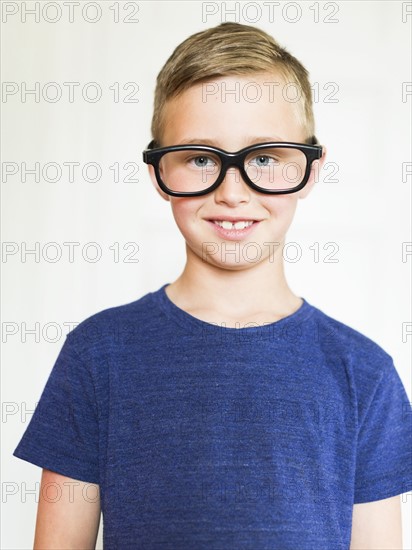 Portrait of boy (6-7) wearing eyeglasses