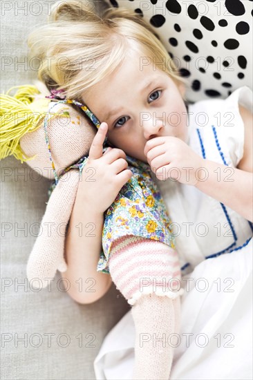 Portrait of girl (2-3) relaxing on sofa