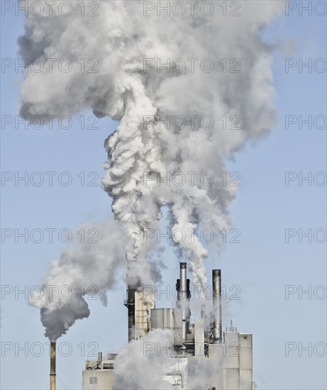 Smoke stacks emitting smoke