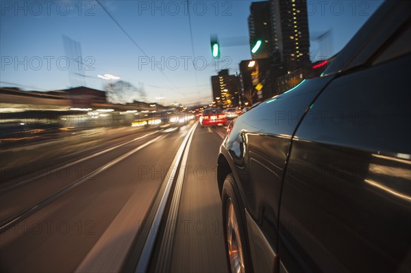 Car speeding along railroad tracks