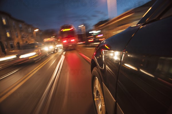 Car speeding along railroad tracks