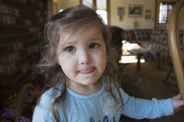 Portrait of girl sticking out tongue