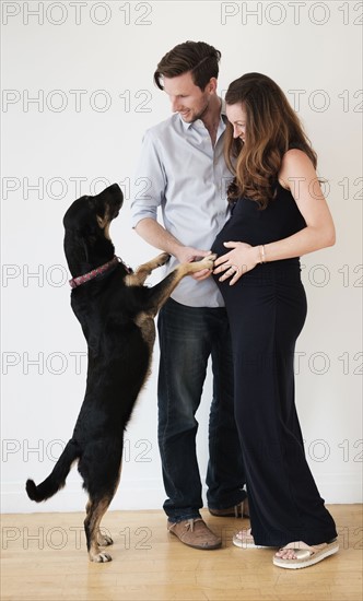 Portrait of couple with dog.