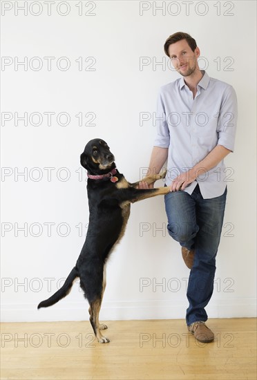 Man playing with dog.