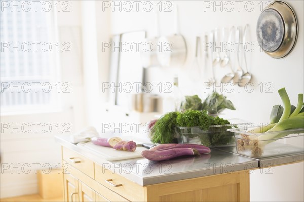 Fresh herbs on kitchen counter.