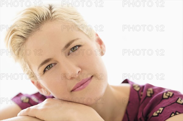 Portrait of young woman on white background.