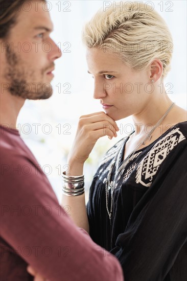 Couple arguing in living room.