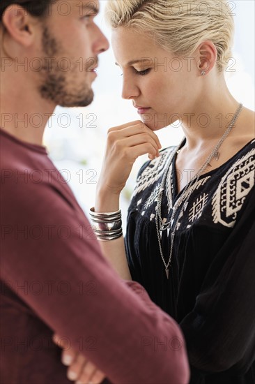 Couple arguing in living room.