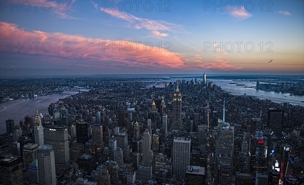 Aerial view of downtown district at sunset. USA, New York, New York City.