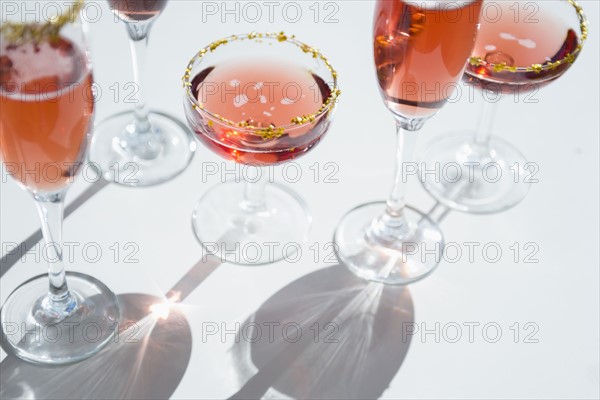 Different wine glasses on white