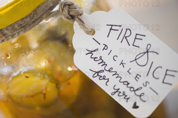 Jar with spicy pickles and hand written tag