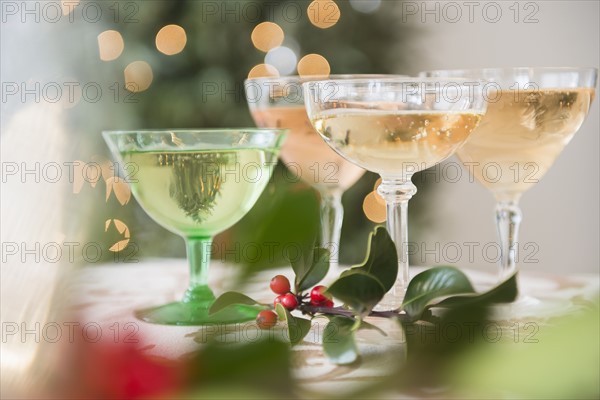 Wine glasses with drinks on festive table