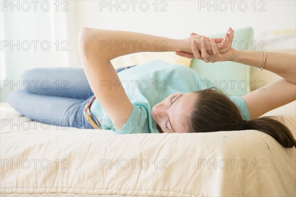 Woman relaxing in bed