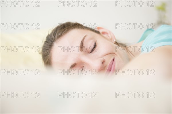 Woman smiling in sleep