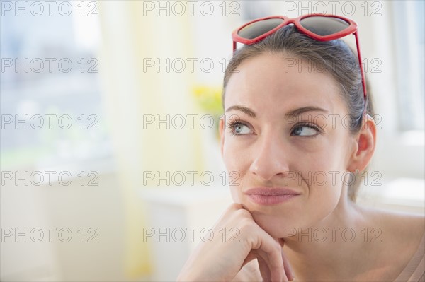 Woman at home contemplating